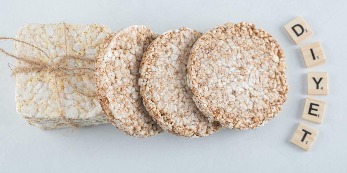 Two types of puffed crispbread tied with rope and wooden letters. High quality photo