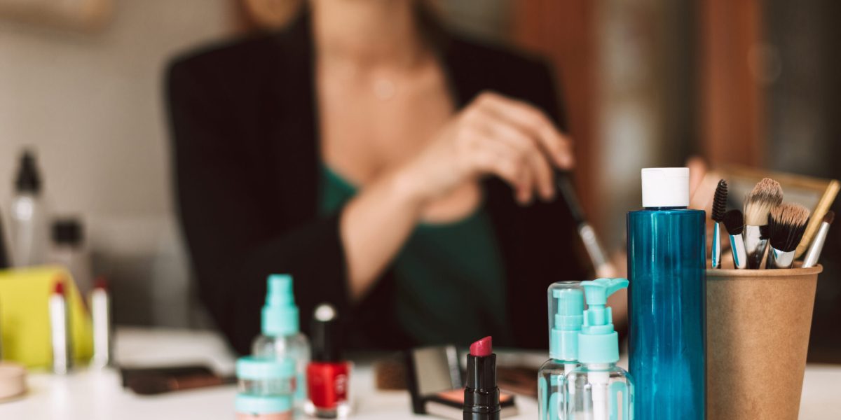 Close up variety of cosmetic products on desk