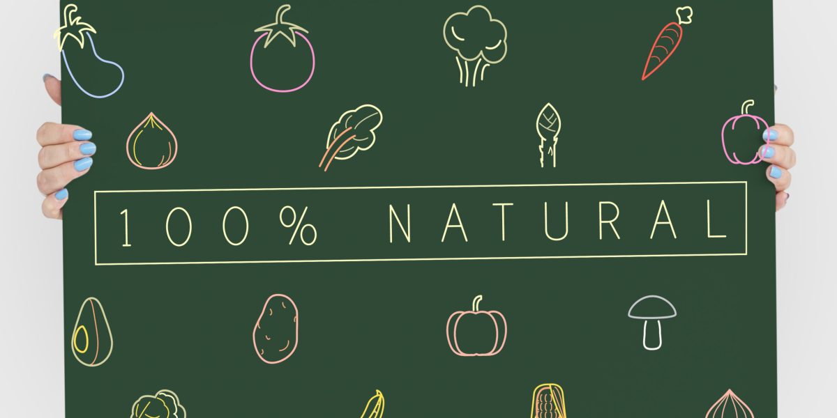 People holding a board about healthy nutrition Veggie